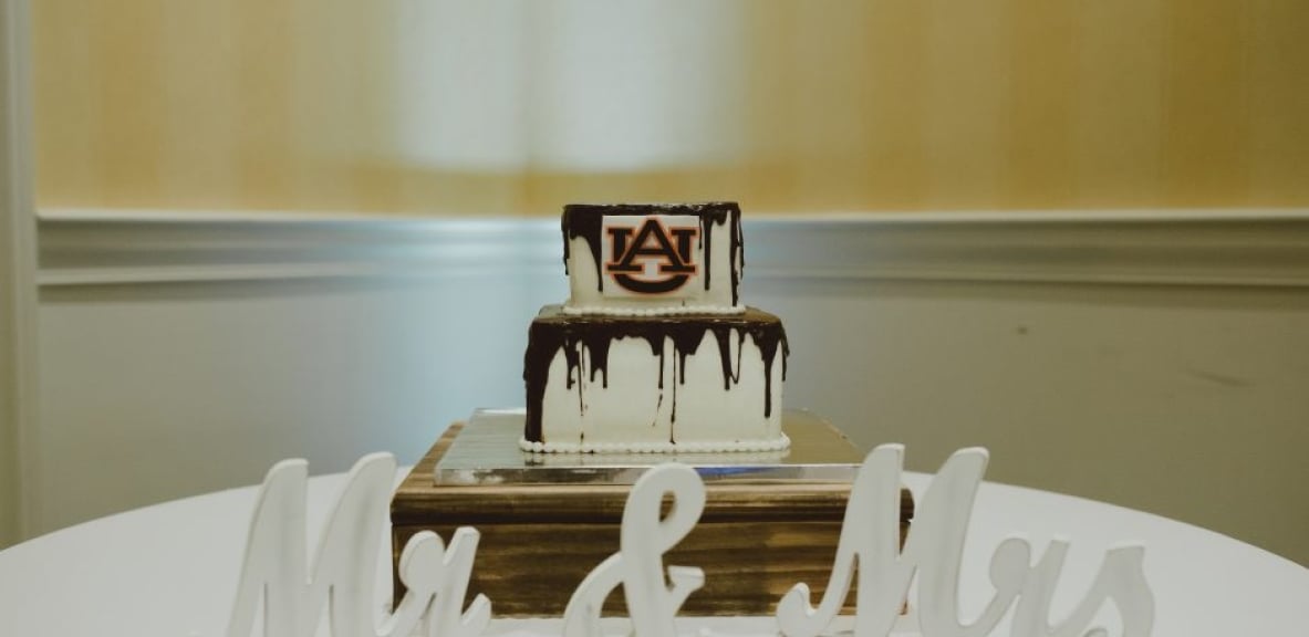 A wedding cake decorated with the initials AU for American University.
