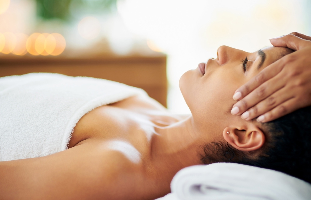 A young woman receiving a relaxing facial at Lilliana Spa