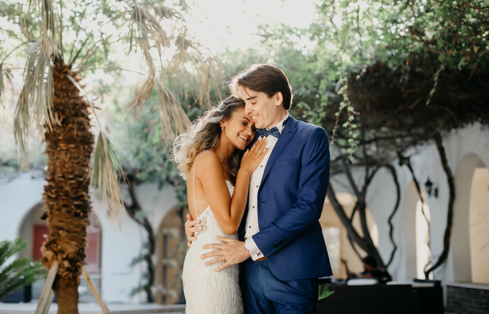 A bride and groom embracing