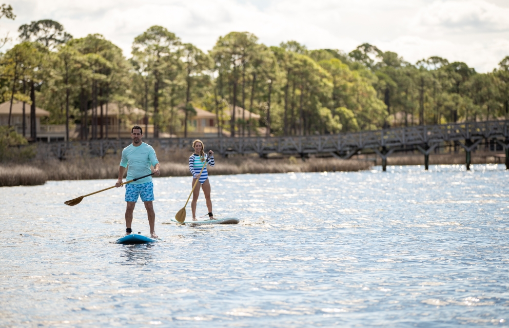a couple paddleboarding
