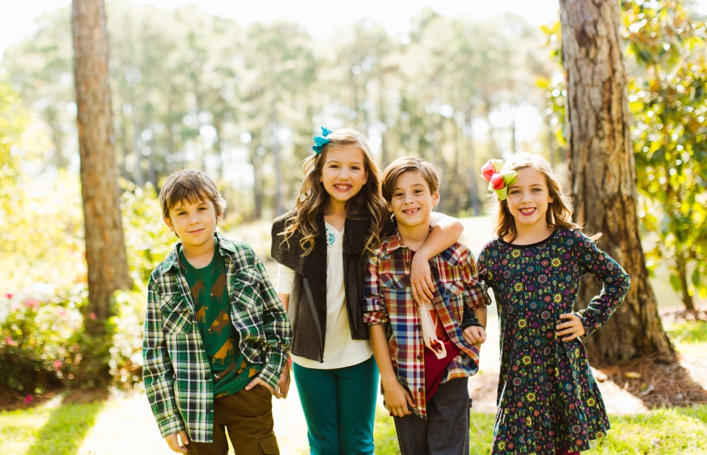 Four children dressed in clothing from coconut kidz at Sandestin Golf and Beach Resort