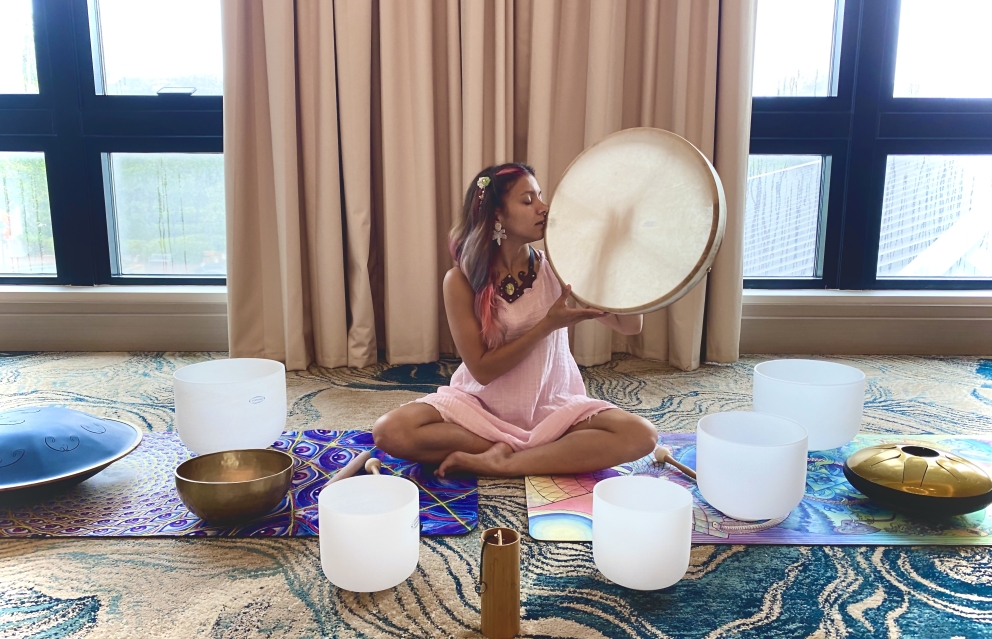 woman on floor conducting sound healing