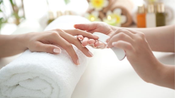 A woman getting her nails done