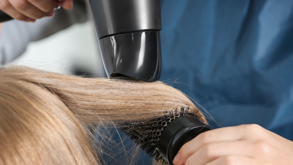 woman getting her hair styled