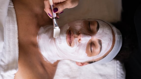 woman receiving a facial treatment