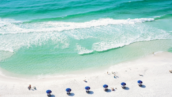 Aerial view of beach umbrellas by the water
