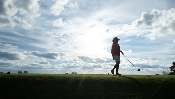 woman playing golf