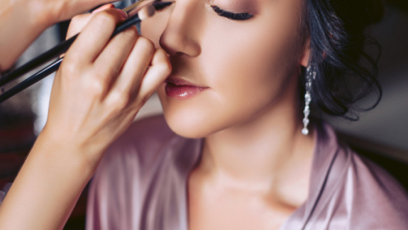 Woman getting makeup done