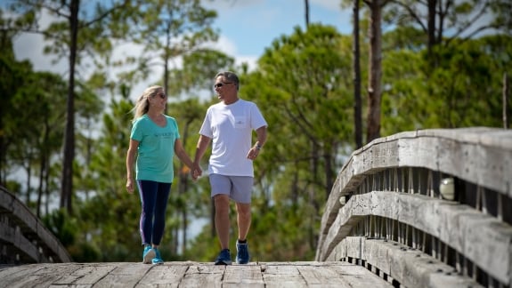 Couple walk on boardwalk