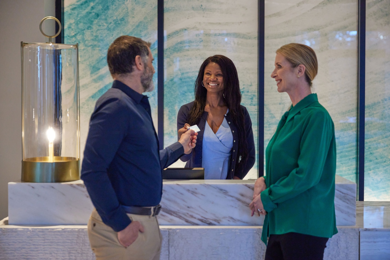 Three people at a counter