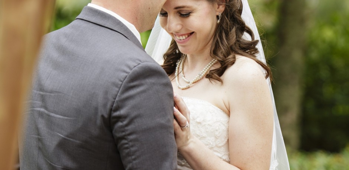 Deborah and James embrace outside of Hotel Effie during their Destin, Florida wedding.