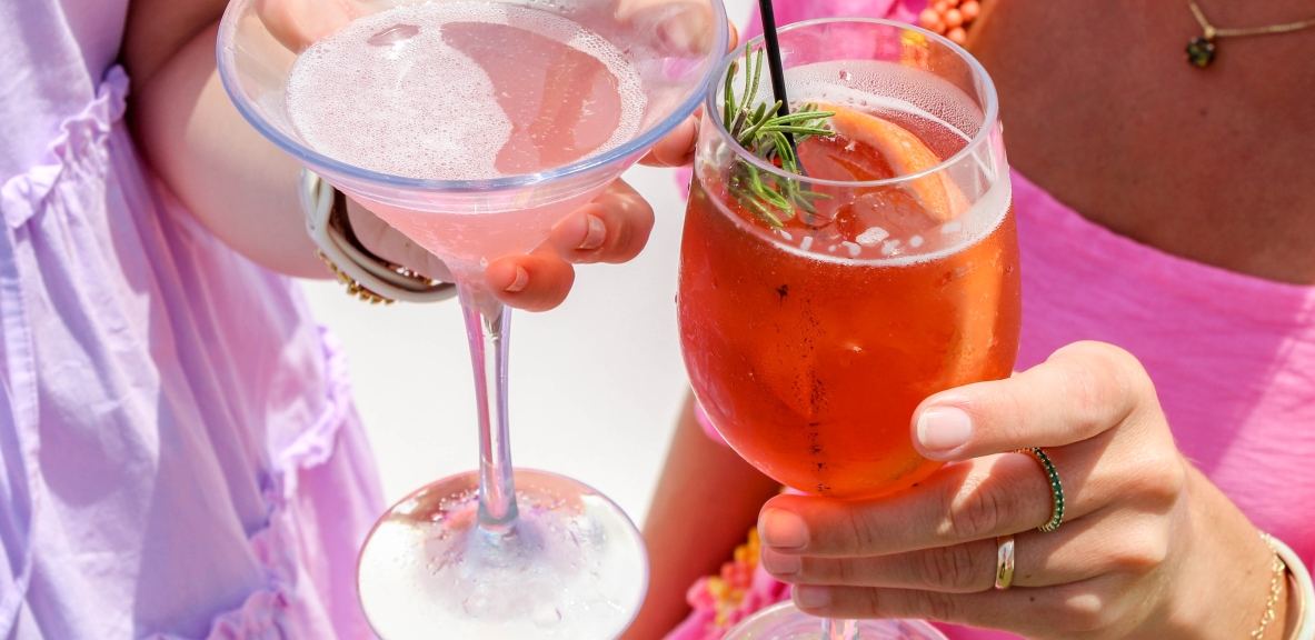 cheers with cocktails at ara