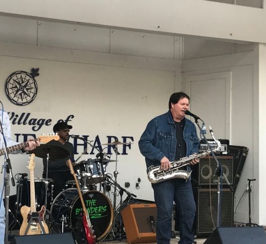 Men singing on stage