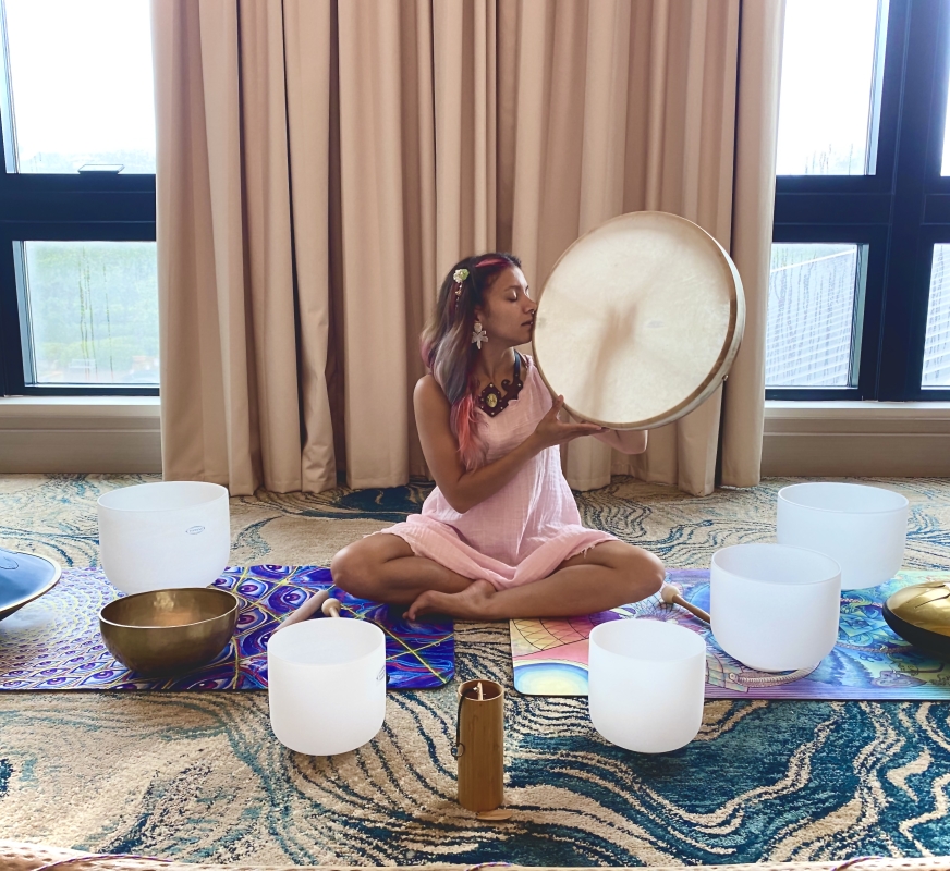 woman on floor conducting sound healing